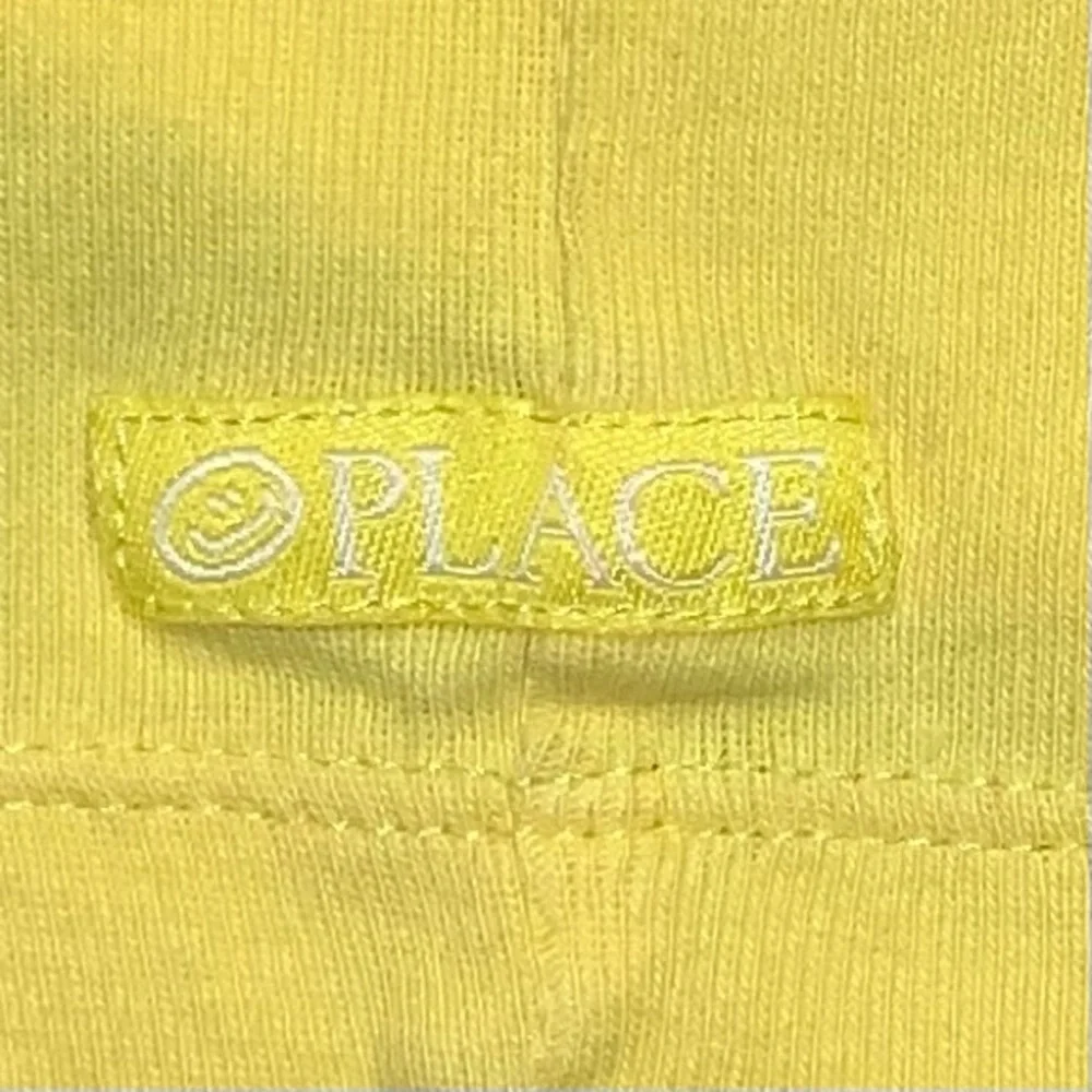 THE CHILDREN’S PLACE yellow tie front shorts.